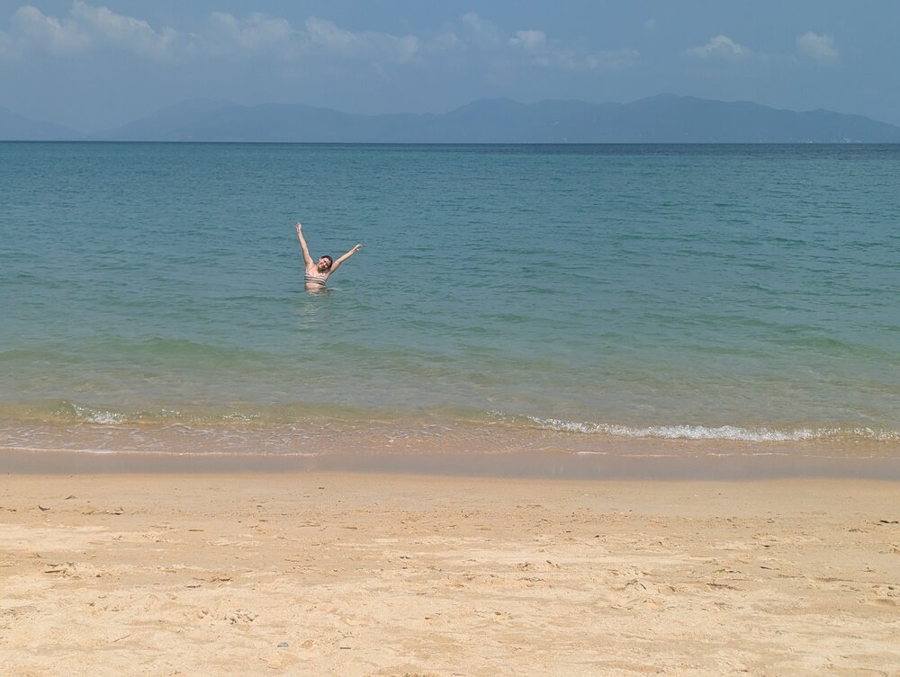 A photo of Sophie on a beach in Thailand.